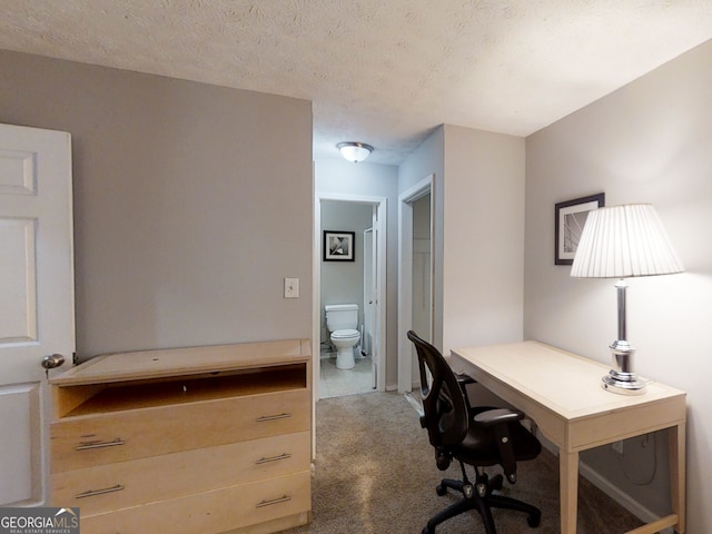 office space featuring a textured ceiling and carpet flooring