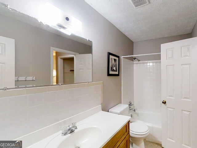 bathroom featuring shower / bath combination, visible vents, toilet, a textured ceiling, and vanity