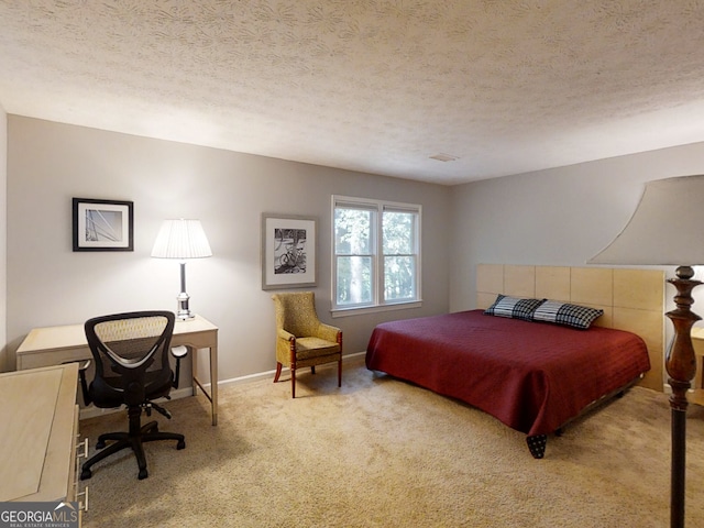 bedroom featuring a textured ceiling, baseboards, and light colored carpet