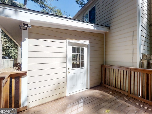 property entrance with a wooden deck