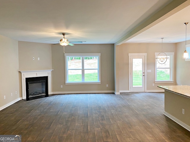 101 Westminster Ct, Winder, GA 30680 - unfurnished living room featuring a ceiling fan, dark wood-type flooring, and plenty of natural light