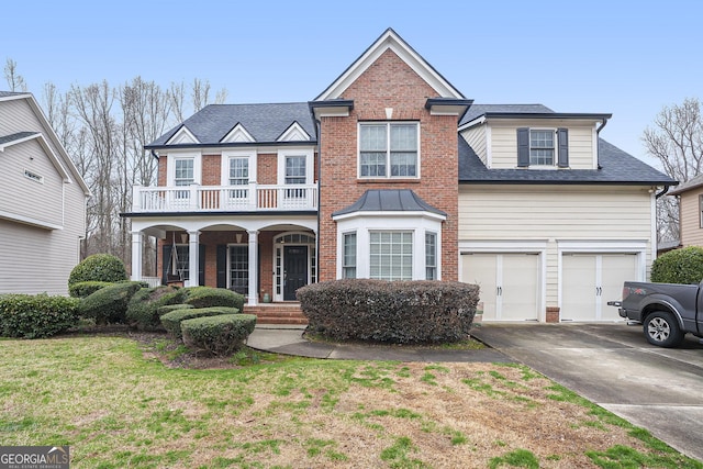 view of front of home featuring brick siding, roof with shingles, covered porch, a balcony, and driveway