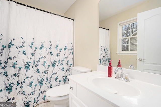 full bathroom with vanity and toilet