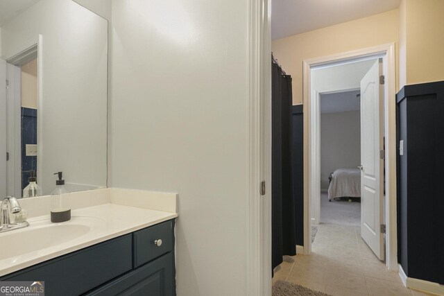 full bathroom with connected bathroom and vanity