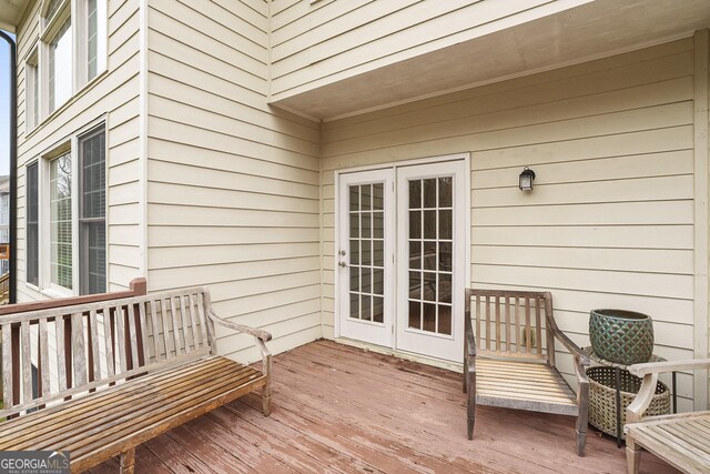 wooden deck featuring french doors