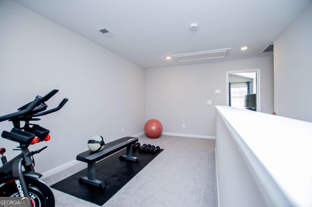 exercise room with carpet flooring, attic access, and recessed lighting