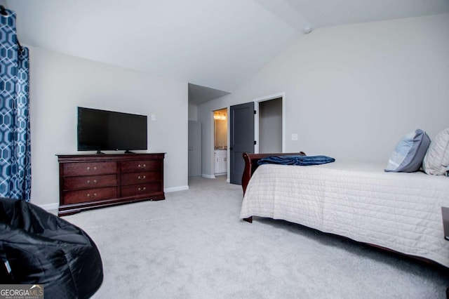 carpeted bedroom featuring vaulted ceiling and baseboards