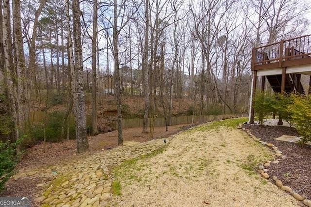 view of yard featuring a wooden deck