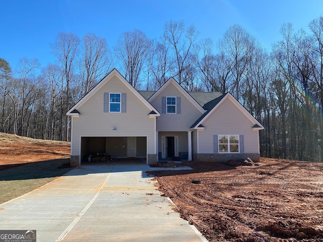 view of front of property with driveway and an attached garage