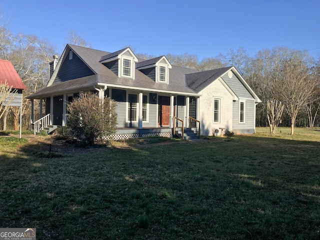 view of front facade featuring entry steps, covered porch, and a front yard