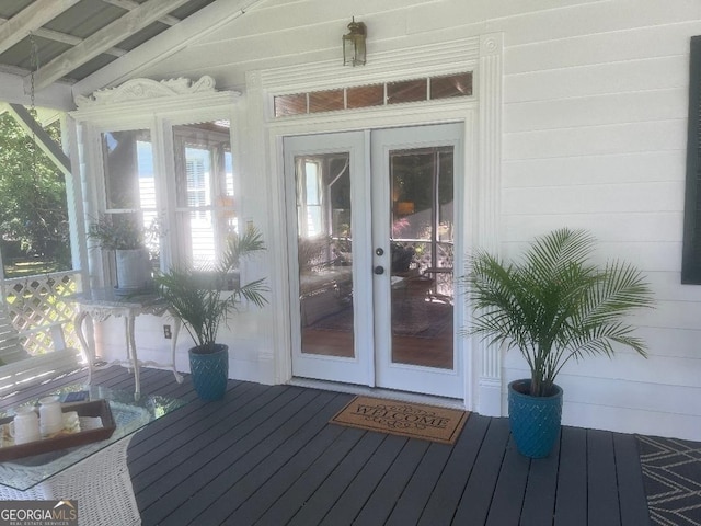 view of exterior entry featuring french doors