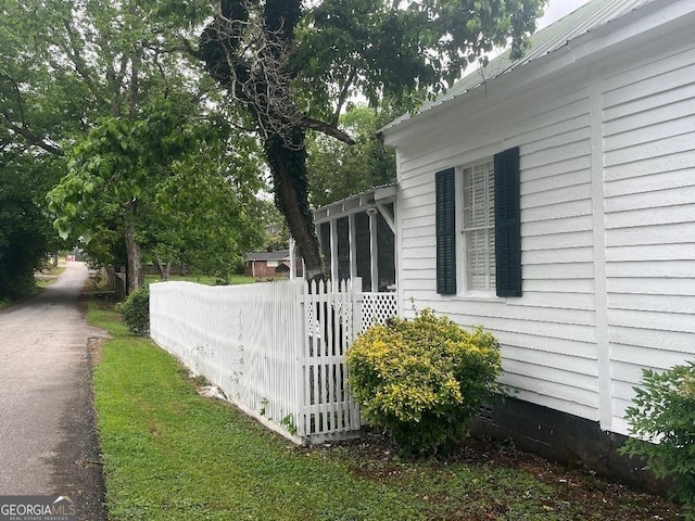 view of side of property with fence