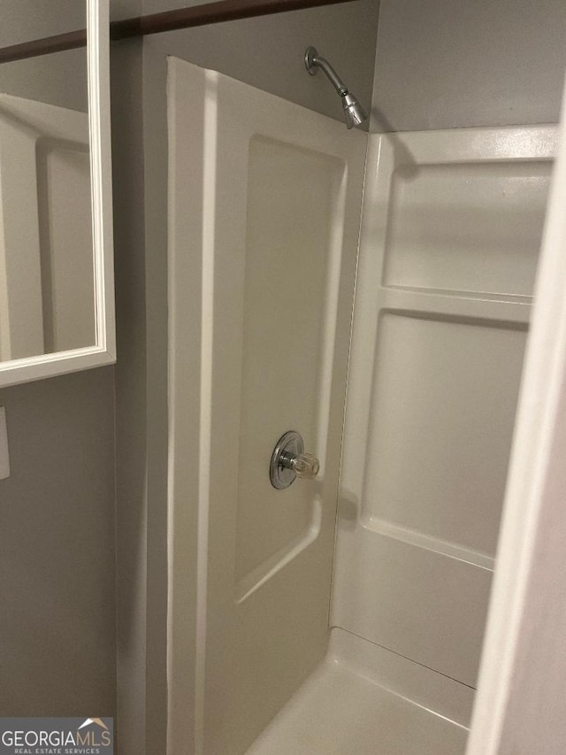 full bathroom featuring walk in shower