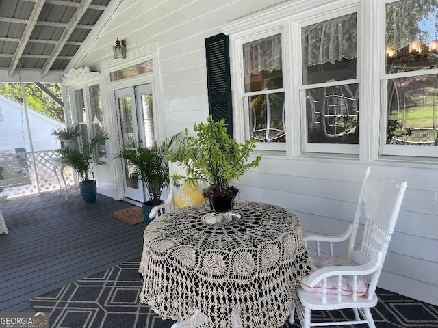 wooden terrace with a porch