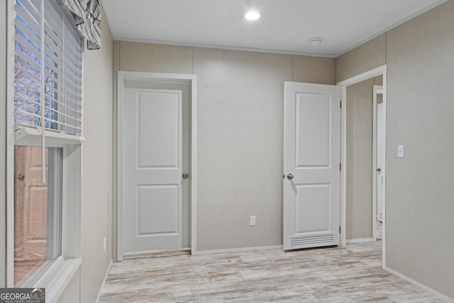 unfurnished room with recessed lighting and light wood-style floors