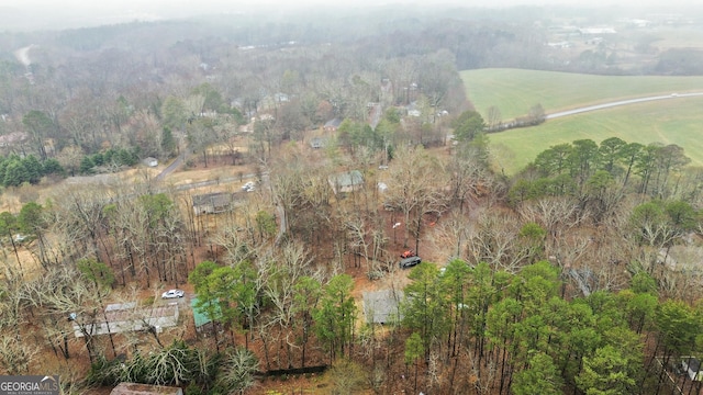 birds eye view of property featuring a rural view