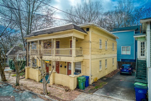 345 Loomis Ave, Atlanta, GA 30312 - view of property exterior with driveway and a balcony