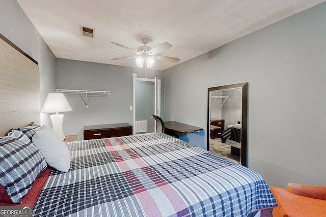 bedroom featuring a closet, visible vents, and a ceiling fan