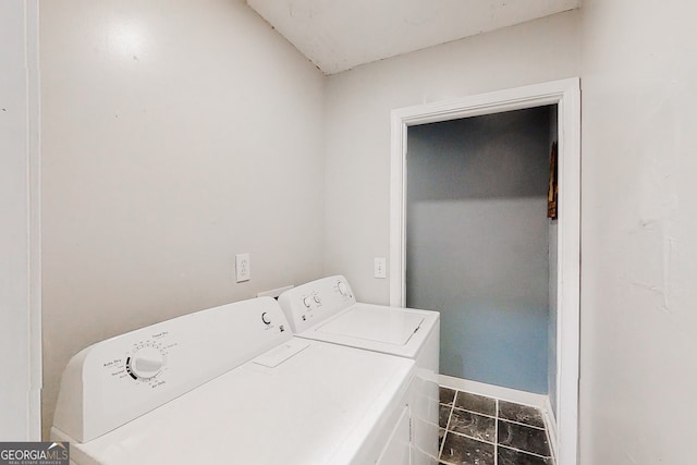 laundry room with baseboards, laundry area, tile patterned flooring, and washer and dryer