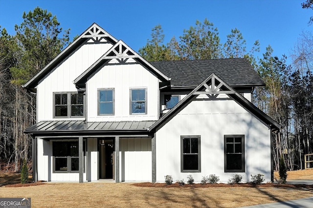 modern inspired farmhouse featuring a standing seam roof and board and batten siding