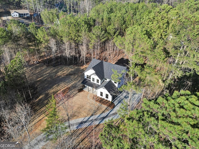 drone / aerial view with a view of trees