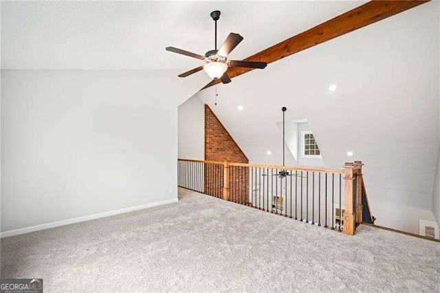 additional living space featuring ceiling fan, carpet, beam ceiling, and baseboards