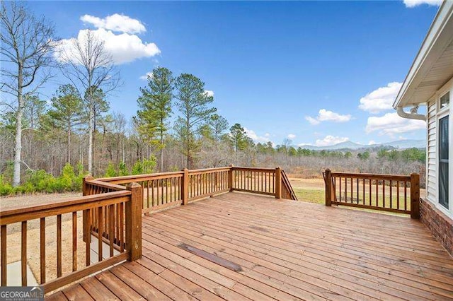 wooden terrace featuring a mountain view