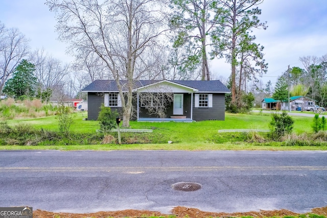 view of front of home with a front lawn