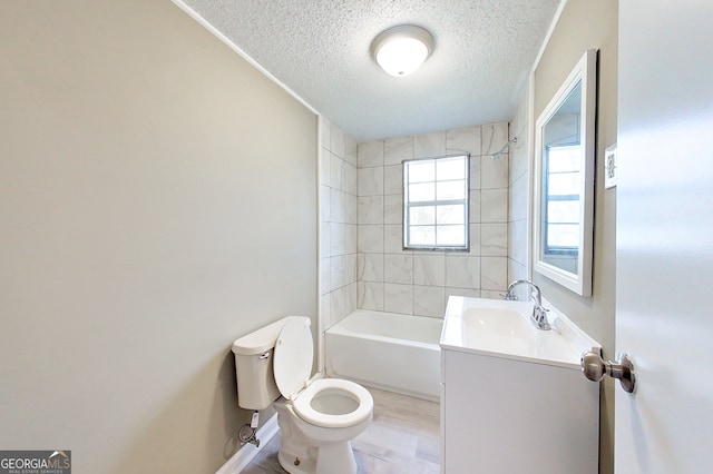 bathroom with shower / bath combination, toilet, a textured ceiling, vanity, and wood finished floors