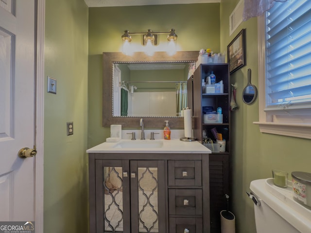 bathroom with vanity and toilet