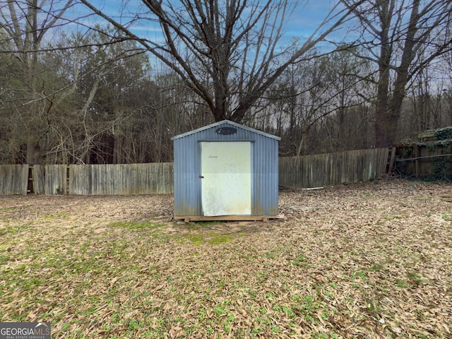 view of shed featuring a fenced backyard