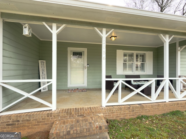 doorway to property with a porch