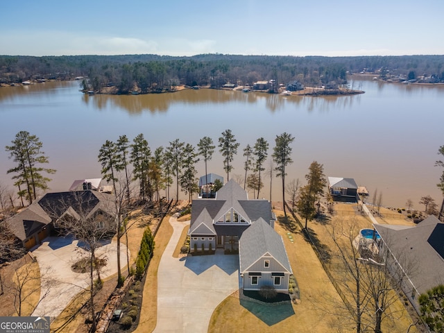 birds eye view of property with a water view