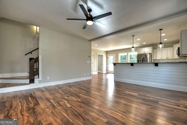 unfurnished living room featuring recessed lighting, stairway, dark wood-type flooring, a ceiling fan, and baseboards