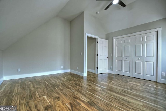 additional living space featuring ceiling fan, vaulted ceiling, baseboards, and dark wood finished floors