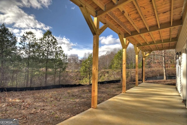 view of patio featuring fence