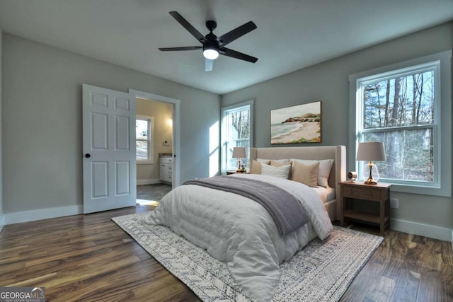 bedroom featuring a ceiling fan, baseboards, and dark wood-style flooring