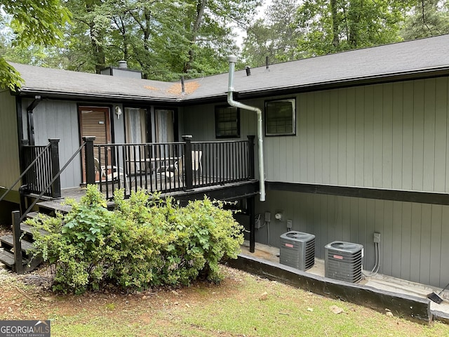 3630 High Point Ln SW, Atlanta, GA 30331 - rear view of property featuring central air condition unit, a wooden deck, and a chimney