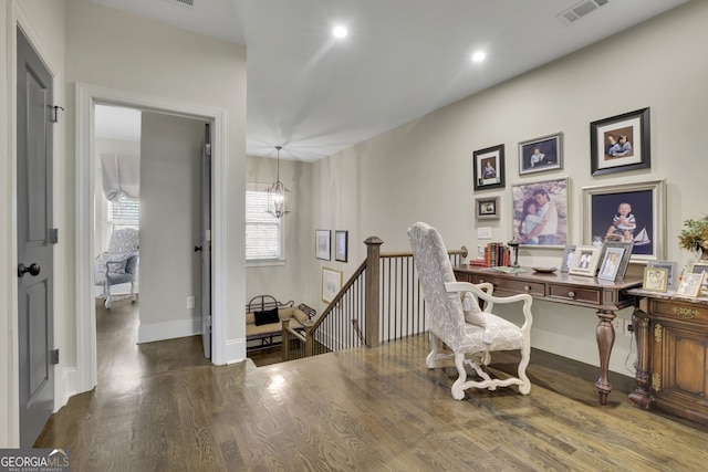 office space with dark wood-style flooring, a notable chandelier, recessed lighting, visible vents, and baseboards