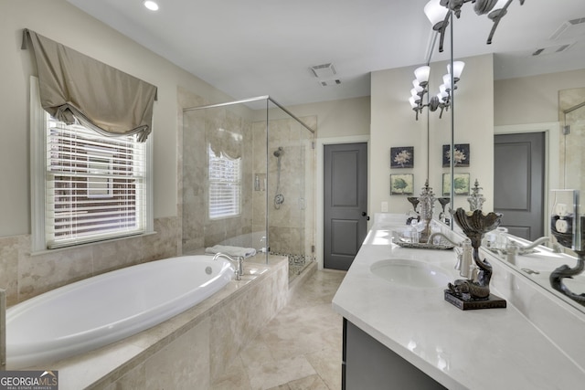 bathroom featuring a garden tub, double vanity, visible vents, a sink, and a shower stall