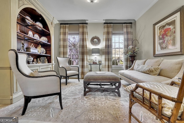 sitting room with ornamental molding