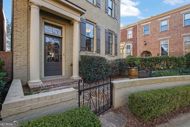 property entrance with brick siding