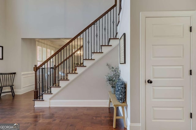 stairs featuring baseboards and wood finished floors