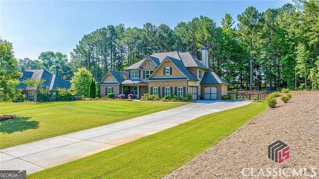 craftsman house featuring concrete driveway, a front lawn, a chimney, and fence