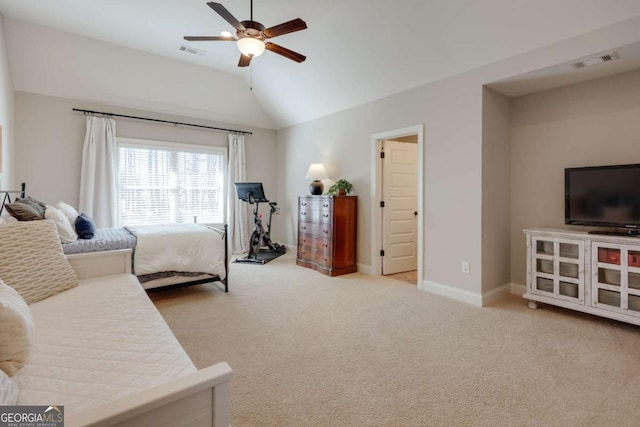 bedroom featuring visible vents, vaulted ceiling, and light colored carpet