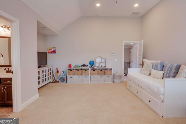 bedroom with light carpet, visible vents, ensuite bathroom, vaulted ceiling, and recessed lighting