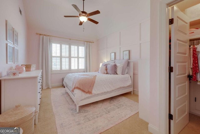 bedroom featuring ceiling fan and light colored carpet