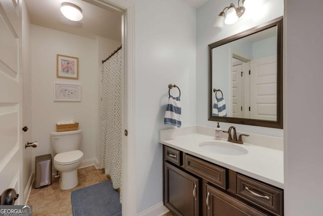 full bath featuring toilet, tile patterned floors, baseboards, and vanity