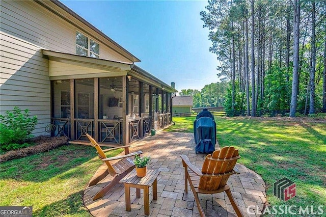 view of patio / terrace featuring a sunroom