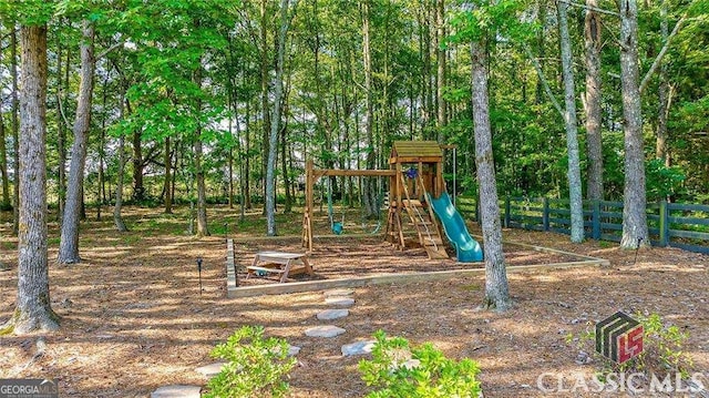 communal playground featuring fence